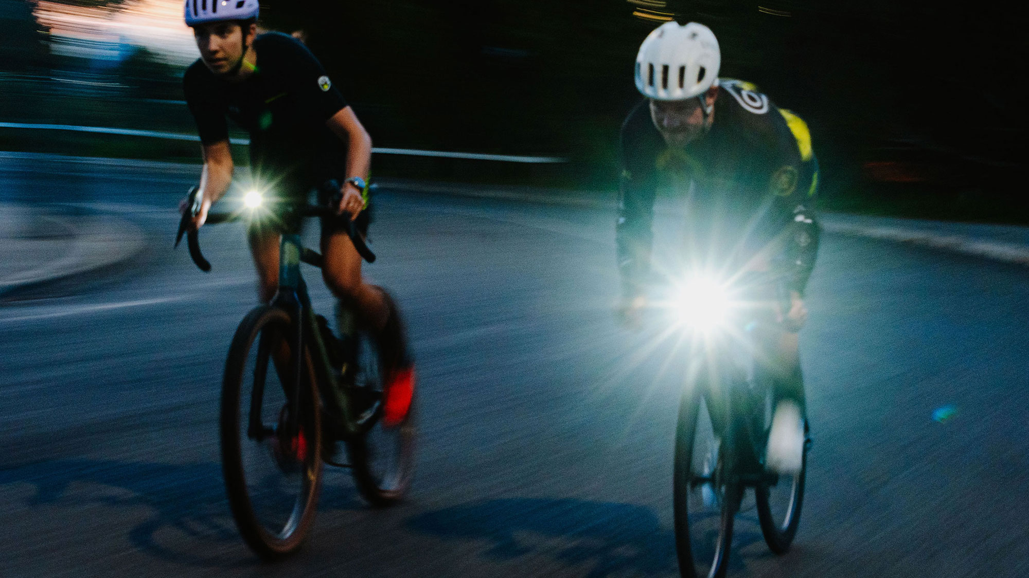 O2+ campaign — two riders, dusk