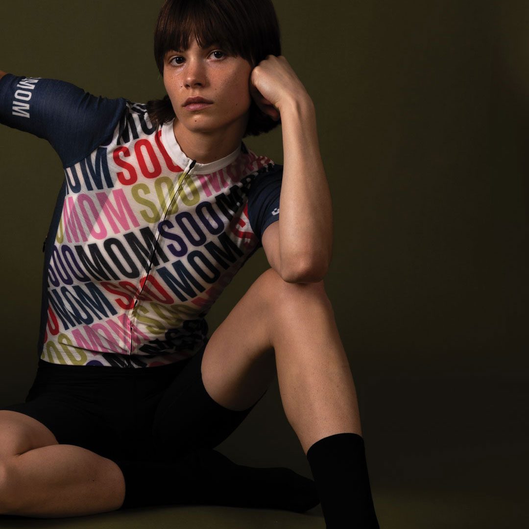 SpinSpin — seated model in the jersey, studio