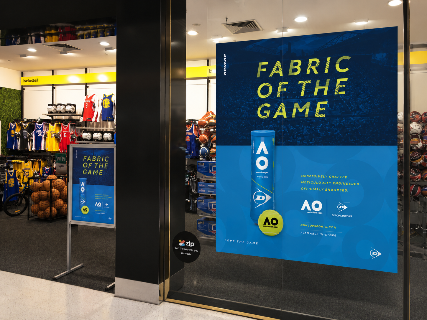 Dunlop Australian Open in-store window signage inside a Rebel Sport store